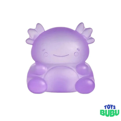 A cute, translucent purple axolotl-shaped toy with a smiling face, set against a plain white background with a 'TOYS BUBU' logo in the bottom right corner.